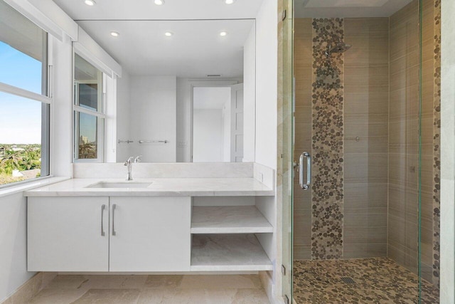 full bath featuring recessed lighting, a shower stall, and vanity