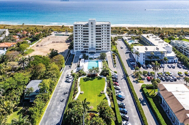 aerial view with a water view and a beach view