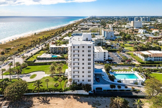 bird's eye view with a water view and a view of the beach