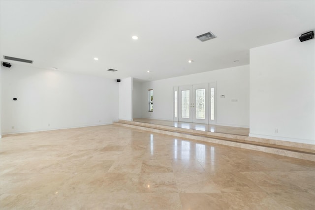 spare room featuring french doors