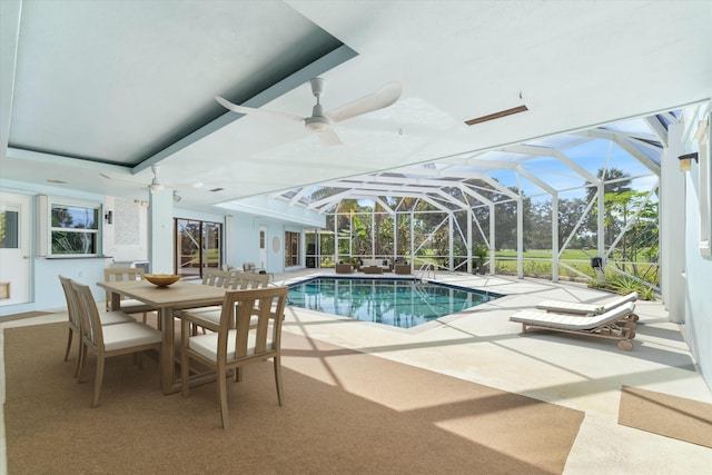 view of swimming pool featuring a lanai and a patio area