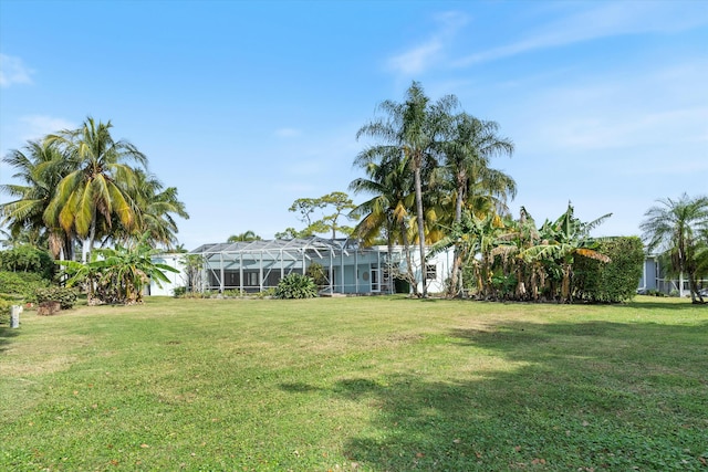 view of yard with a lanai