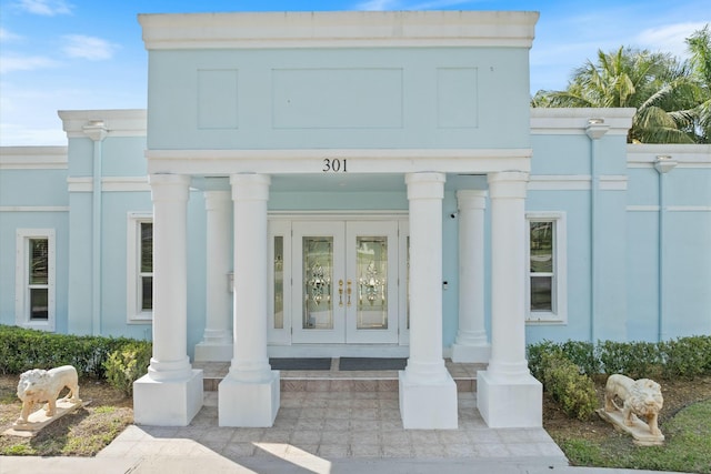 property entrance featuring french doors