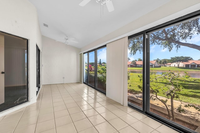 unfurnished sunroom with vaulted ceiling and ceiling fan