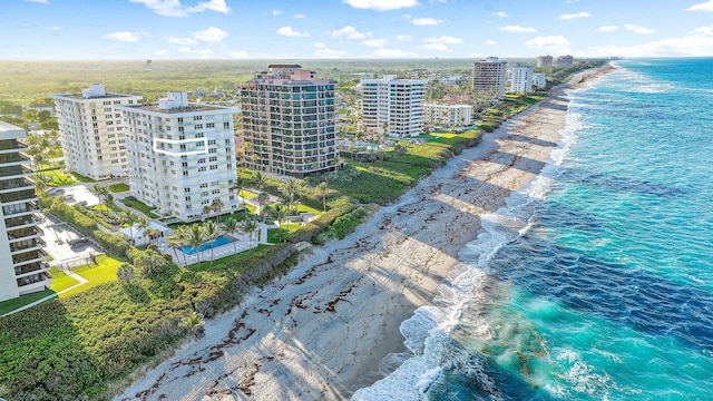 aerial view with a water view and a view of the beach