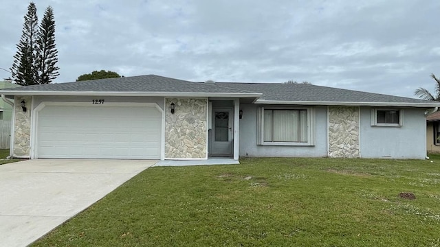 ranch-style home featuring a garage and a front yard