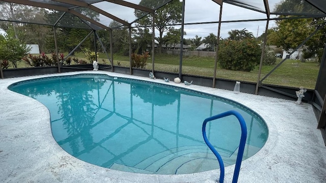 view of pool with a lanai