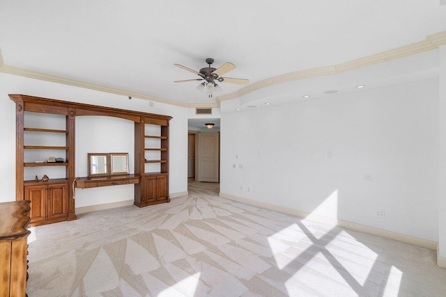 carpeted spare room with ornamental molding and ceiling fan