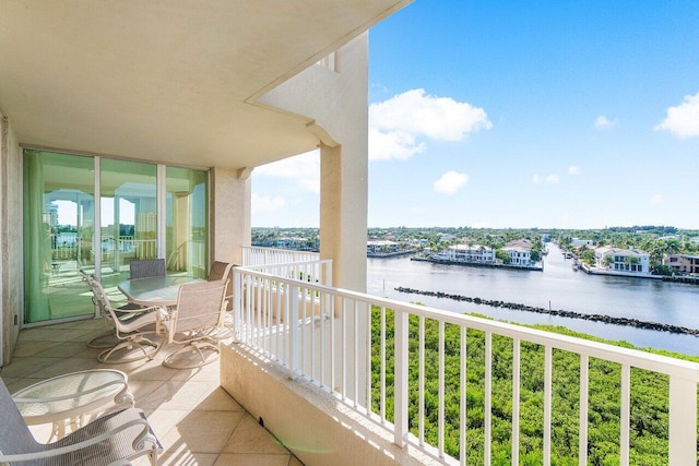 balcony featuring a water view