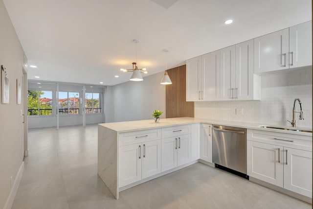 kitchen featuring sink, white cabinets, kitchen peninsula, and dishwasher