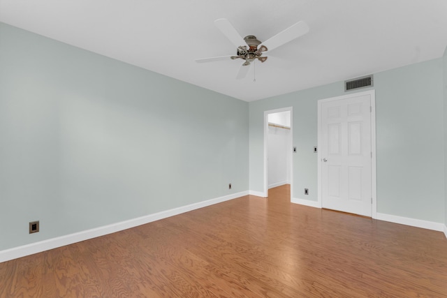 spare room featuring hardwood / wood-style flooring and ceiling fan