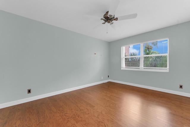 empty room featuring hardwood / wood-style floors and ceiling fan