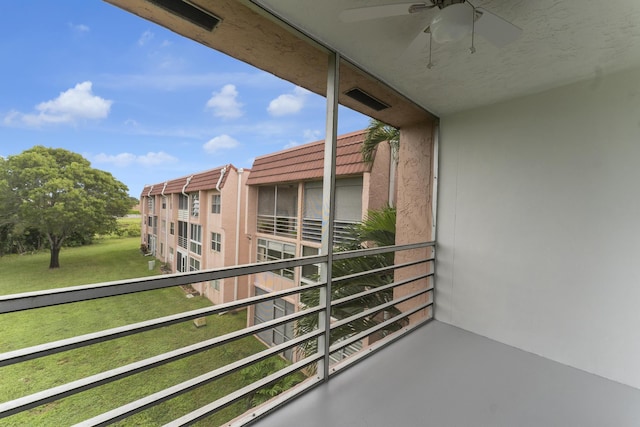 balcony featuring ceiling fan