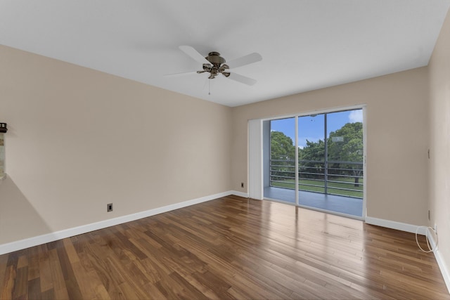 empty room featuring hardwood / wood-style floors and ceiling fan