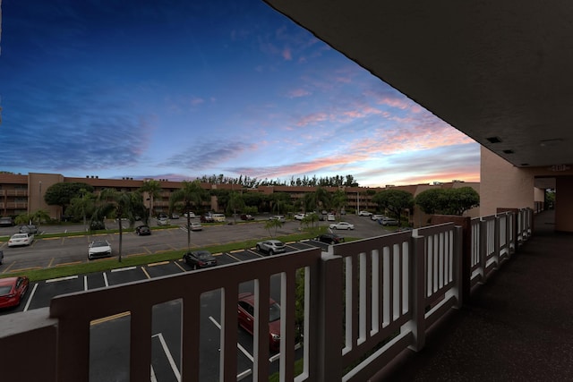 view of balcony at dusk