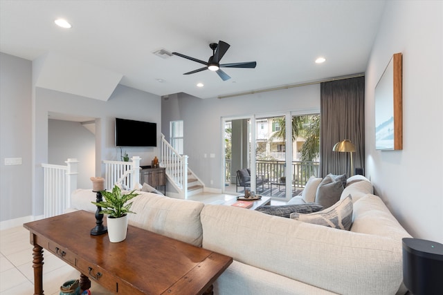 tiled living room featuring ceiling fan