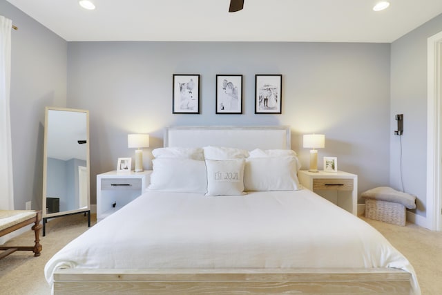 carpeted bedroom featuring ceiling fan