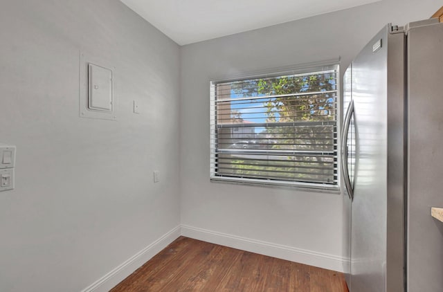 spare room featuring dark wood-type flooring