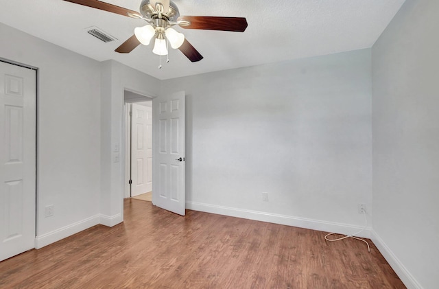 unfurnished bedroom with ceiling fan and light hardwood / wood-style floors