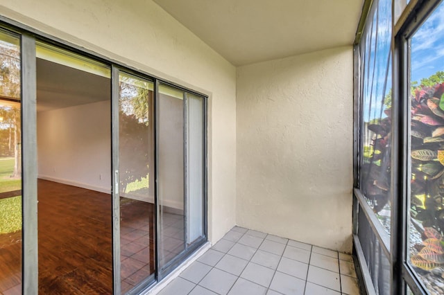 unfurnished sunroom featuring a wealth of natural light