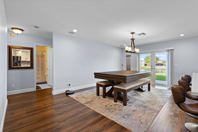 dining room featuring dark hardwood / wood-style flooring and french doors