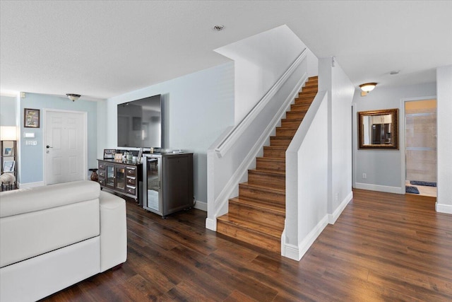 living room with dark hardwood / wood-style flooring