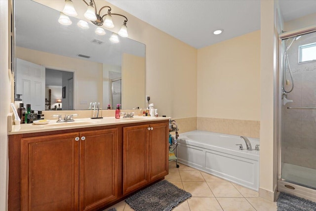 bathroom with tile patterned flooring, vanity, separate shower and tub, and a notable chandelier