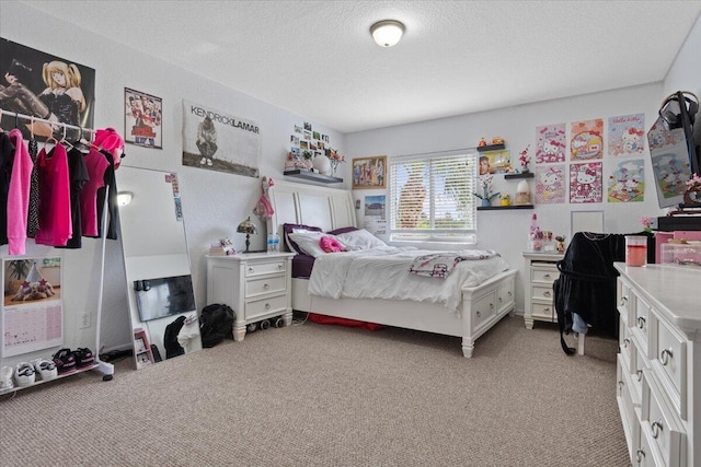 carpeted bedroom featuring a textured ceiling