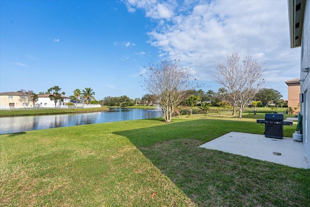 view of yard featuring a patio area and a water view