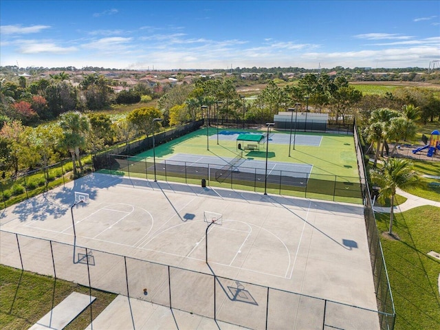 exterior space featuring a playground and tennis court