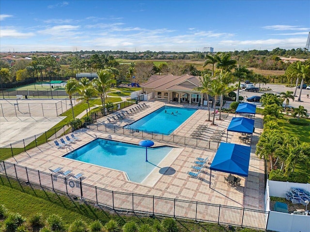 view of swimming pool featuring a patio area