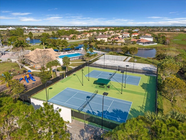 birds eye view of property with a water view