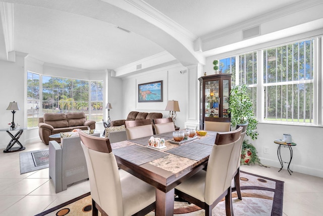 dining area featuring light tile patterned floors, visible vents, and crown molding