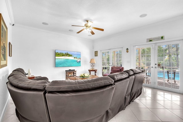 living room with light tile patterned floors, crown molding, and french doors