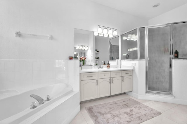 full bath with lofted ceiling, tile patterned floors, a stall shower, vanity, and a bath