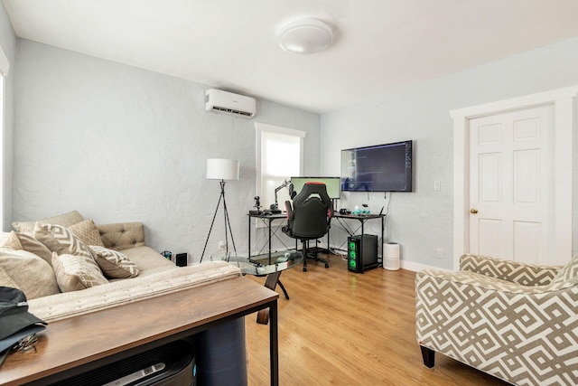 office space featuring light hardwood / wood-style flooring and a wall mounted AC