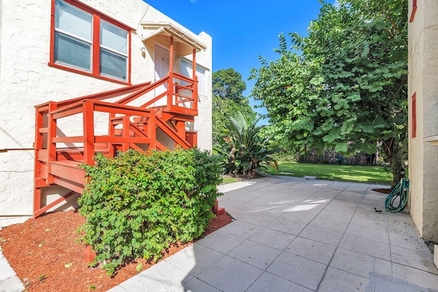 exterior space with a yard and a patio area