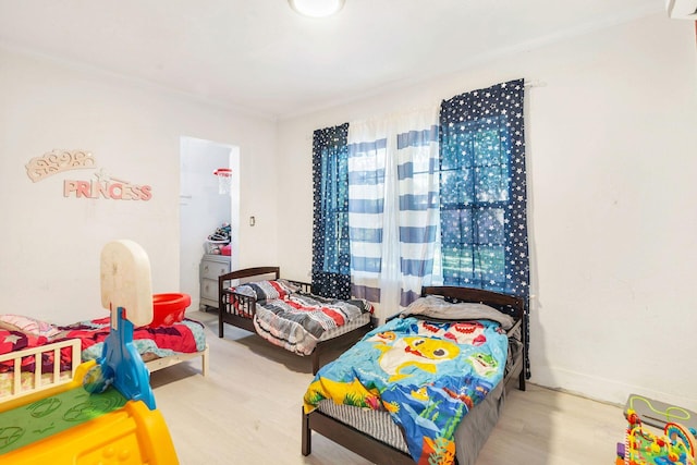 bedroom with wood-type flooring