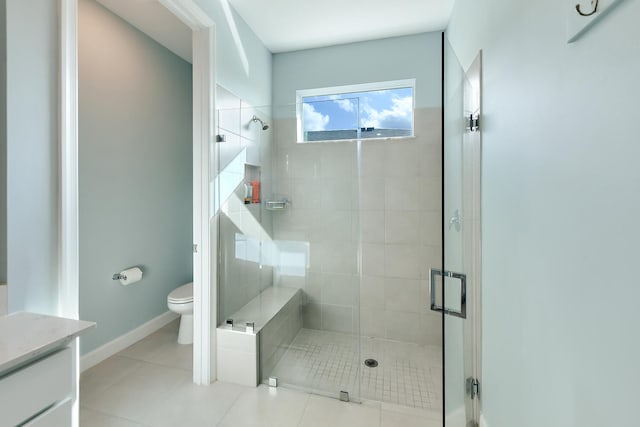 bathroom with walk in shower, tile patterned floors, and toilet