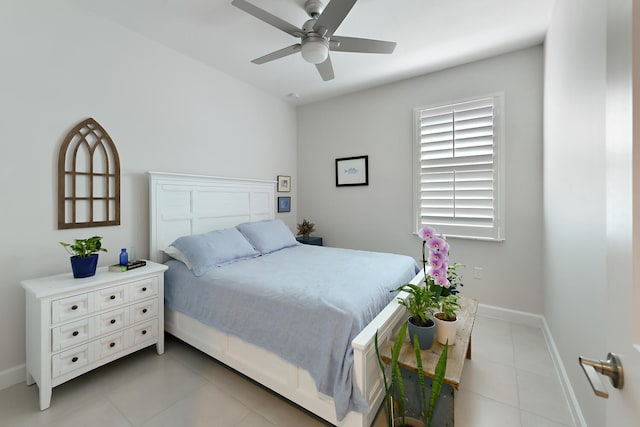 tiled bedroom featuring ceiling fan