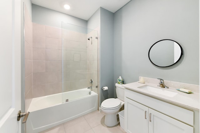 full bathroom featuring vanity, toilet, tiled shower / bath combo, and tile patterned flooring