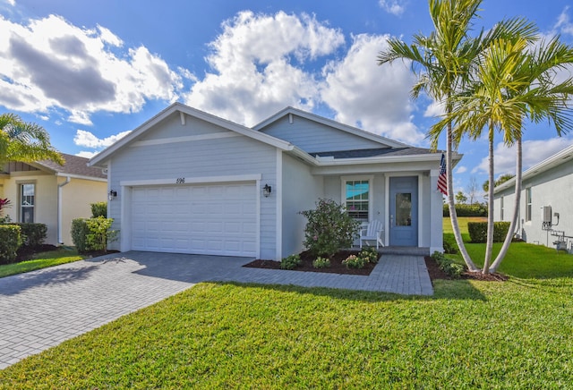 view of front of home featuring a garage and a front yard