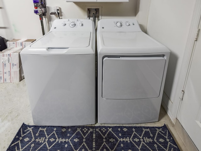 washroom featuring washing machine and dryer