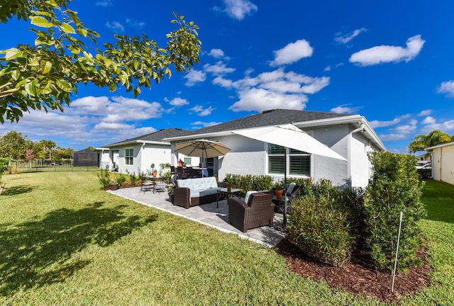 rear view of house with an outdoor hangout area, a yard, and a patio area