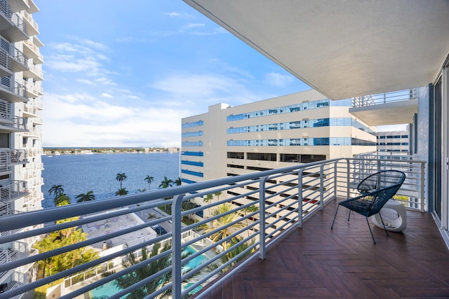 balcony featuring a water view