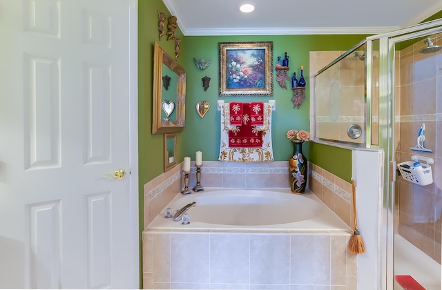 bathroom featuring ornamental molding and shower with separate bathtub