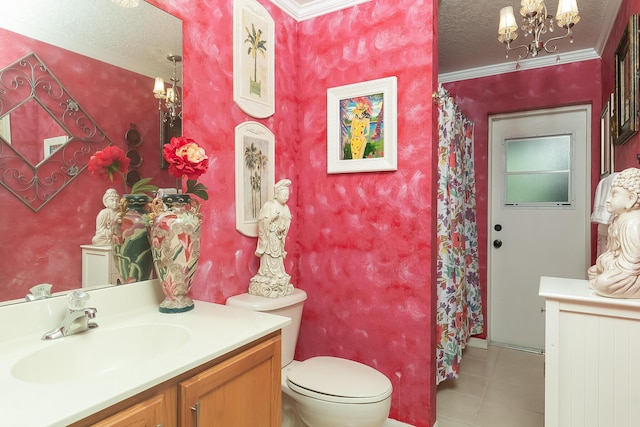 bathroom featuring toilet, a textured ceiling, ornamental molding, vanity, and a notable chandelier