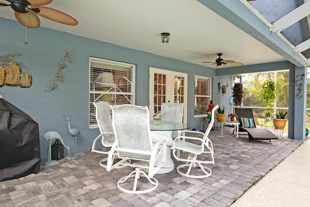 view of patio with area for grilling and ceiling fan