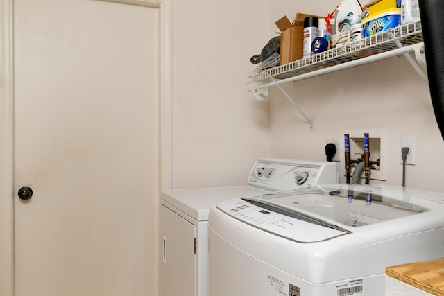 laundry room featuring separate washer and dryer