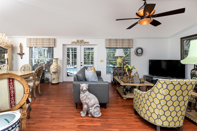 living room featuring french doors, ceiling fan, ornamental molding, and dark wood-type flooring